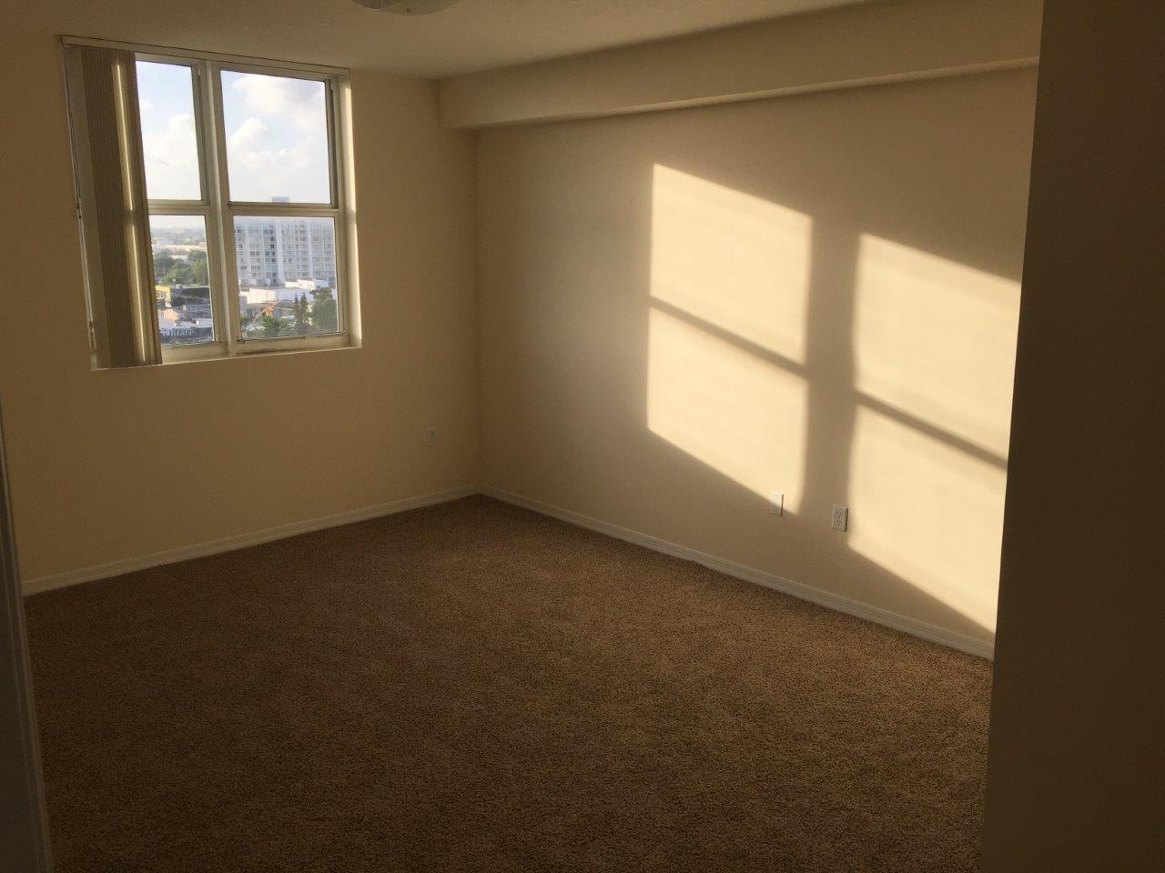 Sunlit bedroom with city views