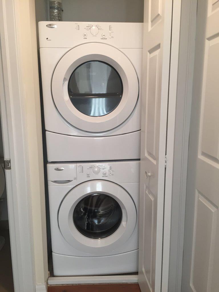 In-unit stacked washer and dryer