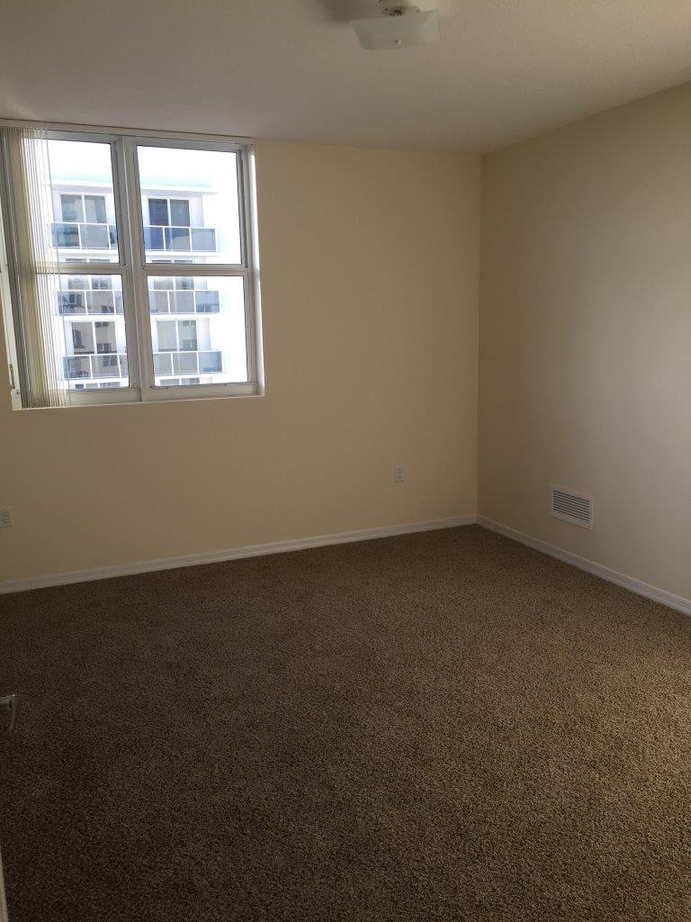 Residence bedroom with neighboring tower views
